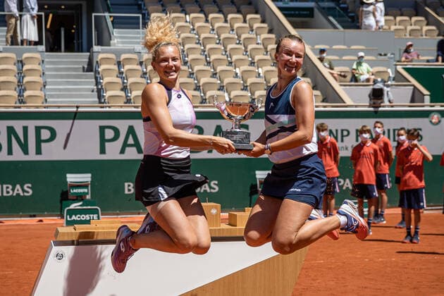 (210613) -- PARIS, June 13, 2021 -- Barbora Krejcikova (R) Katerina Siniakova pose with their trophy after winning the women s doubles final between Barbora Krejcikova Katerina Siniakova of the Czech Republic and Iga Swiatek of Poland Bethanie Mattek-Sands of the United States at the French Open tennis tournament at Roland Garros in Paris, France, June 13, 2021. (Photo by Xinhua) (SP)FRANCE-PARIS-TENNIS-ROLAND GARROS-FRENCH OPEN-WOMEN S DOUBLES-FINAL AurelienxMorissard 