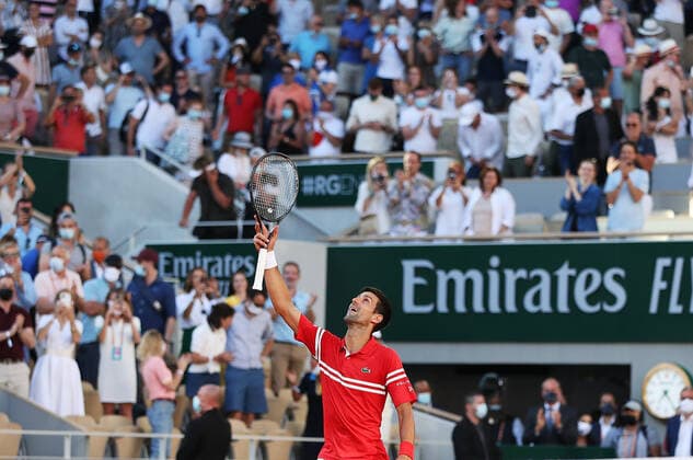 (210614) -- PARIS, June 14, 2021 -- Novak Djokovic of Serbia celebrates his victory after winning the Men s Singles finals match against Stefanos Tsitsipas of Greece at the French Open tennis tournament at Roland Garros in Paris, France, June 13, 2021. ) (SP)FRANCE-PARIS-TENNIS-ROLAND GARROS-FRENCH OPEN-MEN S SINGLES-FINALS GaoxJing 
