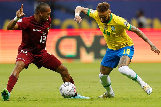 (210614) -- BRASILIA, June 14, 2021 -- Brazil s Neymar (R) vies with Venezuela s Jose Martinez during the Group B match between Brazil and Venezuela at the 2021 Copa America in Brasilia, Brazil, June 13, 2021. Lucio Tavora) (SP)BRAZIL-BRASILIA-FOOTBALL-COPA AMERICA-BRAZIL VS VENEZUELA e LUCIOxTAVORA 