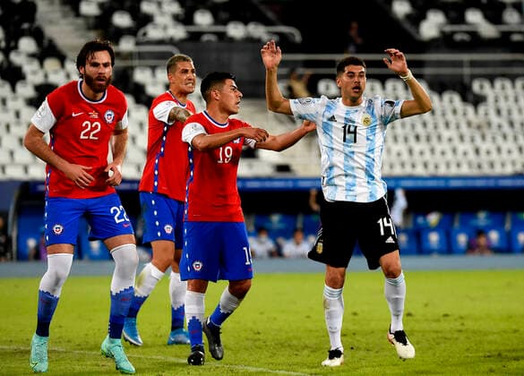 RIO DE JANEIRO, BRAZIL - JUNE 14: Exequiel Palacios of Argentina competes with Tomas Alarcon of Chile ,during the match between Argentina and Chile as part of Conmebol Copa America Brazil 2021 at Estadio Olimpico Nilton Santos on June 14, 2021 in Rio de Janeiro, Brazil. SPO, SOC, FOC, FOI, ICH 