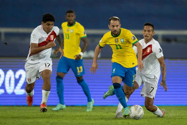 17th June 2021; Nilton Santos Stadium, Rio de Janeiro, Brazil; Copa America, Brazil versus Peru; & xc9;verton Ribeiro of Brazil and Luis Iberico, Gerald T& xe1;vara of Peru  ActionPlus12297263 LucasxFigueiredo