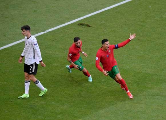 19.06.2021, Fussball, Europameisterschaft 2020, Gruppenspiel Gruppe F, Portugal - Deutschland, in der Fußball Arena München. re: Christiano Ronaldo (Portugal) Torjubel, li: Kai Havertz (Deutschland) traurig