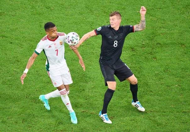 Toni Kroos, DFB 8 compete for the ball, tackling, duel, header, zweikampf, action, fight against Loic Nego, HUN 7 in the Group F match GERMANY - HUNGARY 2-2 at the football UEFA European Championships 2020 in Season 2020 2021 on June 23, 2021 in Munich, Germany.