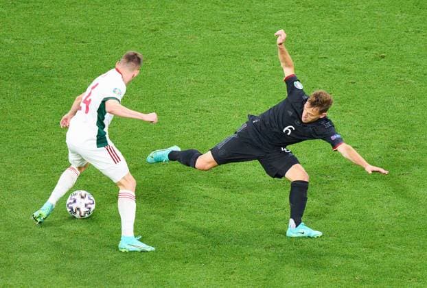 Joshua KIMMICH, DFB 6 compete for the ball, tackling, duel, header, zweikampf, action, fight against Szabolcs Schön, HUN 24 in the Group F match GERMANY - HUNGARY 2-2 at the football UEFA European Championships 2020 in Season 2020 2021 on June 23, 2021 in Munich, Germany.
