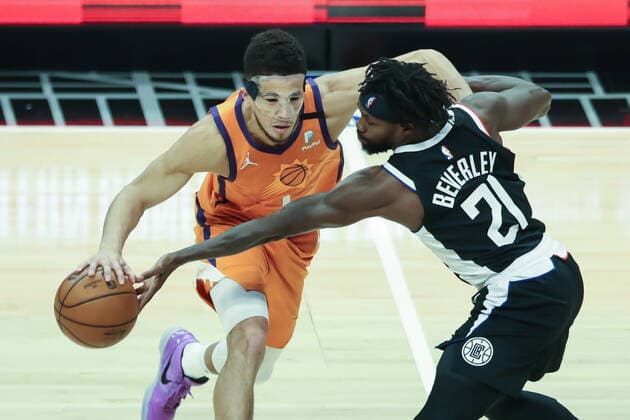 LOS ANGELES, CA - JUNE 24: LA Clippers guard Patrick Beverley (21) tips the ball from Phoenix Suns guard Devin Booker (1) during the Phoenix Suns game versus the Los Angeles Clippers game 3 NBA, Basketball Herren, USA Western Conference Finals game on June 24, 2021, at Staples Center in Los Angeles, CA. (Photo by Jevone Moore Icon Sportswire) NBA: JUN 24 Western Conference Final - Suns at Clippers Icon210624054
