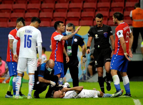 BRASILIA, BRAZIL - JUNE 24: Gary Medel and Francisco Sierralta of Chile argues with the Referee Wimar Roldan ,during the match between Chile and Paraguay as part of Conmebol Copa America Brazil 2021 at Mane Garrincha Stadium on June 24, 2021 in Brasilia, Brazil. SPO, SOC, ICH 