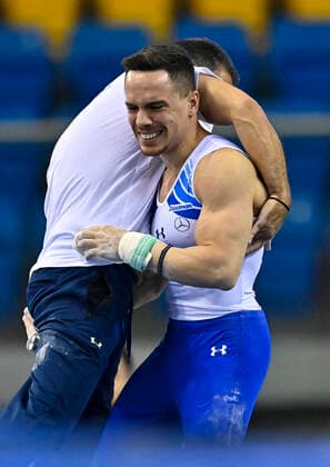(210626) -- DOHA, June 26, 2021 -- Eleftherios Petrounias of Greece celebrates with his coach during the Men s Rings Final at the 13th FIG Artistic Gymnastics World Cup in Doha, capital of Qatar, on June 25, 2021. (Photo by Xinhua) (SP)QATAR-DOHA-GYMNASTICS-WORLD CUP Nikku 