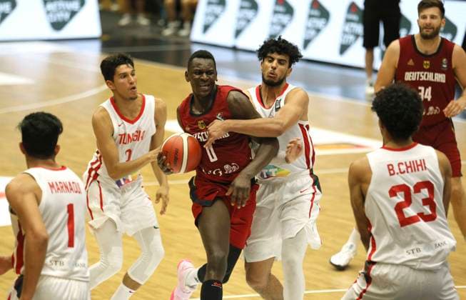 Photo : Isaac Bonga ( Germany ) gegen Ahmed Addami Basketball - Supercup Sat. 19.06. 2021 4 Nations Cup in Hamburg Deutschland - Tunesien