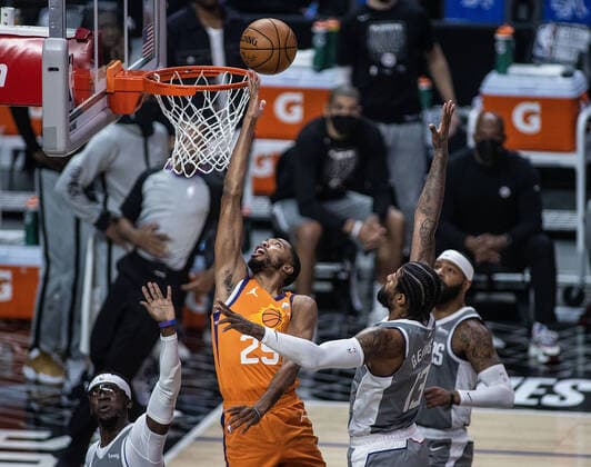 June 26, 2021, Los Angeles, California, USA: Mikal Bridges 25 of the Phoenix Suns puts up a layup past Paul George 13 of the Los Angeles Clippers during Game 4 of the 2021 Western Conference finals NBA, Basketball Herren, USA playoff game on Saturday June 26, 2021 at the Staples Center in Los Angeles, California. Clippers lose to Suns 80 - 84. JAVIER ROJASPI Los Angeles USA - ZUMAp124 20210626_zaa_p124_008 Copyright: xx