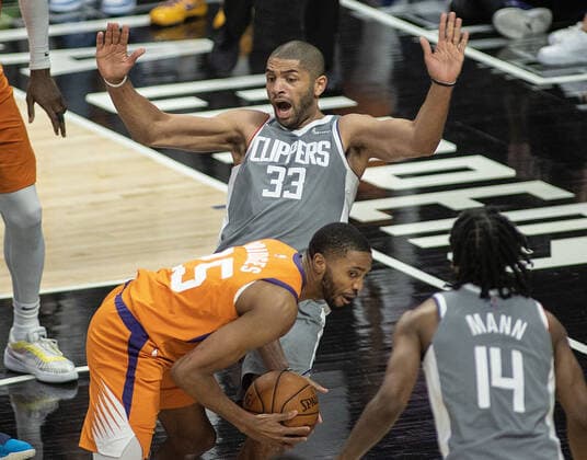June 26, 2021, Los Angeles, California, USA: Nicolas Batum 33 of the Los Angeles Clippers is fouled by Mikal Bridges 25 of the Phoenix Suns during Game 4 of the 2021 Western Conference finals NBA, Basketball Herren, USA playoff game on Saturday June 26, 2021 at the Staples Center in Los Angeles, California. Clippers lose to Suns 80 - 84. JAVIER ROJASPI Los Angeles USA - ZUMAp124 20210626_zaa_p124_057 Copyright: xx