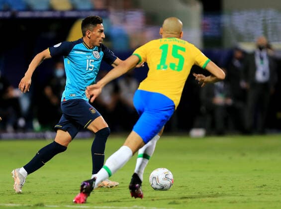 GOIANIA, BRAZIL - JUNE 27: Angel Mena of Ecuador competes for the ball with Fabinho of Brazil ,during the match between Brazil and Ecuador as part of Conmebol Copa America Brazil 2021 at Estadio Olimpico on June 27, 2021 in Goiania, Brazil. SPO, SOC 