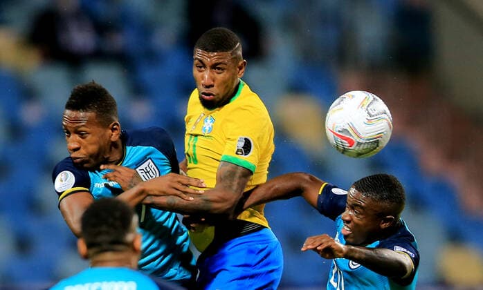 GOIANIA, BRAZIL - JUNE 27: Emerson of Brazil head the ball against Pervis Estupinan and Jhegson Mendez of Ecuador ,during the match between Brazil and Ecuador as part of Conmebol Copa America Brazil 2021 at Estadio Olimpico on June 27, 2021 in Goiania, Brazil. SPO, SOC 