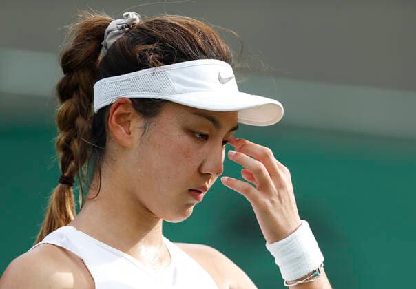 (210629) -- LONDON, June 29, 2021 -- Wang Xinyu of China is seen during the women s singles first round match between Sofia Kenin of the United States and Wang Xinyu of China at the 2021 Wimbledon Tennis Championships in London, Britain, on June 28, 2021. ) (SP)BRITAIN-LONDON-TENNIS-WIMBLEDON-DAY 1 HanxYan 