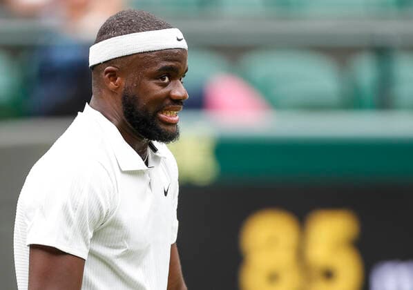 (210629) -- LONDON, June 29, 2021 -- Frances Tiafoe of the United States reacts during the men s singles first round match between Frances Tiafoe of the United States and Stefanos Tsitsipas of Greece at the 2021 Wimbledon Tennis Championships in London, Britain, on June 28, 2021. ) (SP)BRITAIN-LONDON-TENNIS-WIMBLEDON-DAY 1 HanxYan 