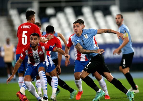 RIO DE JANEIRO, BRAZIL - JUNE 28: Jose Gimenez of Uruguay competes with Junior Alonso of Paraguay ,during the match between Uruguay and Paraguay as part of Conmebol Copa America Brazil 2021 at Estadio Olimpico Nilton Santos on June 28, 2021 in Rio de Janeiro, Brazil. SPO, SOC, ICH 