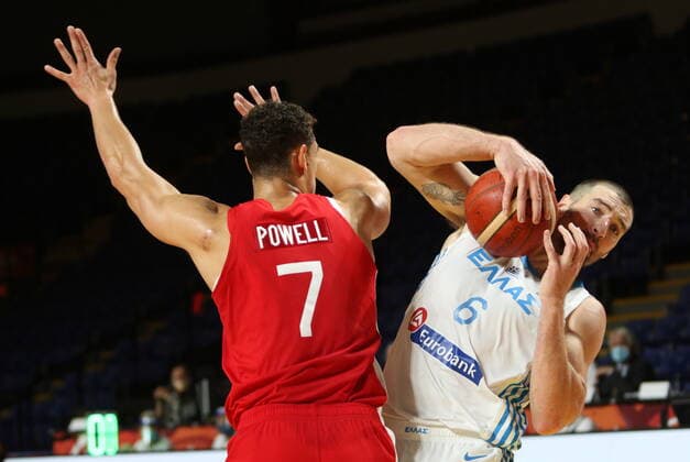 June 29, 2021, Victoria, BC, Canada: Canada s Dwight Powell tries to block Greece s Vassilis Kavvadas during first half FIBA Men s Olympic Qualifying basketball action at Memorial Arena in Victoria, Tuesday, June 29, 2021. Vassilis Kavvadas,Dwight Powell  - ZUMAc35_ 20210629_zaf_c35_019 Copyright: xChadxHipolitox