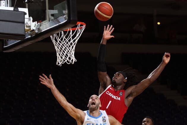 June 29, 2021, Victoria, BC, Canada: Canada s Dort Luguentz drives to the basket as Greece s Nick Calathes tries to block during second half FIBA Men s Olympic Qualifying basketball action at Memorial Arena in Victoria, Tuesday, June 29, 2021. Dort Luguentz,Nick Calathes  - ZUMAc35_ 20210629_zaf_c35_032 Copyright: xChadxHipolitox