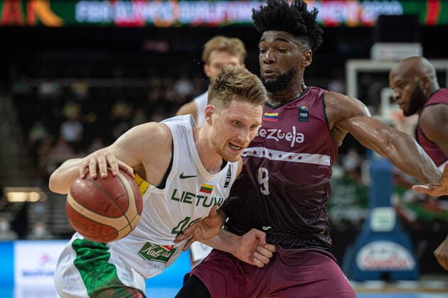 (210630) -- KAUNAS, June 30, 2021 -- Marius Grigonis (L) of Lithuania competes during FIBA Olympic Qualifyng Tournament basketball match between Lithuania and Venezuela in Kaunas, Lithuania, June 29, 2021. (Photo by Xinhua) (SP)LITHUANIA-KAUNAS-BASKETBALL-FIBA OQT-LITHUANIA VS VENEZUELA AlfredasxPliadis 