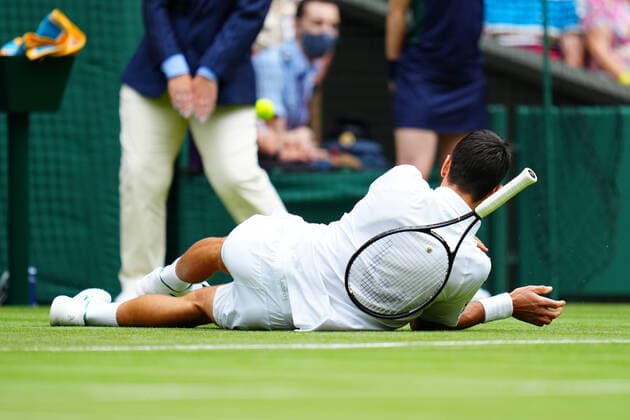 Mandatory Credit: Photo by Javier Garcia BPI Shutterstock (12189891m) Novak Djokovic slips during his second round match Wimbledon Tennis Championships, Day 3, The All England Lawn Tennis and Croquet Club, London, UK - 30 Jun 2021 Wimbledon Tennis Championships, Day 3, The All England Lawn Tennis and Croquet Club, London, UK - 30 Jun 2021  Copyright: xJavierxGarcia BPI Shutterstockx 12189891m