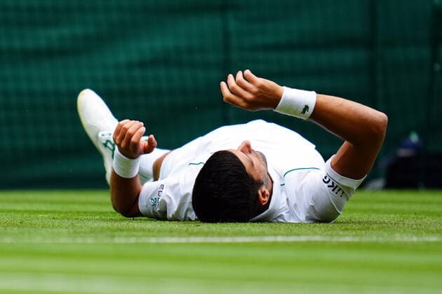 Mandatory Credit: Photo by Javier Garcia BPI Shutterstock (12189891be) Novak Djokovic slips over during his second round match Wimbledon Tennis Championships, Day 3, The All England Lawn Tennis and Croquet Club, London, UK - 30 Jun 2021 Wimbledon Tennis Championships, Day 3, The All England Lawn Tennis and Croquet Club, London, UK - 30 Jun 2021  Copyright: xJavierxGarcia BPI Shutterstockx 12189891be