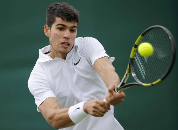 Mandatory Credit: Photo by Shutterstock (12190133by) Carlos Alcaraz of Spain in action Wimbledon Tennis Championships, Day 3, The All England Lawn Tennis and Croquet Club, London, UK - 30 Jun 2021 Wimbledon Tennis Championships, Day 3, The All England Lawn Tennis and Croquet Club, London, UK - 30 Jun 2021  Copyright: xShutterstockx 12190133by