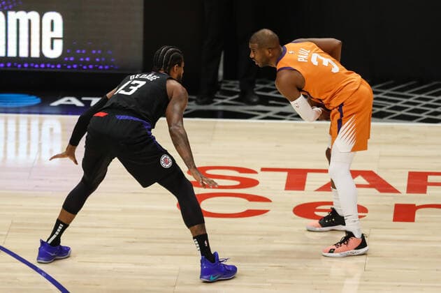 LOS ANGELES, CA - JUNE 30: LA Clippers guard Paul George (13) guarding Phoenix Suns guard Chris Paul (3) during game 6 of the NBA, Basketball Herren, USA Western Conference Final between the Phoenix Suns and the Los Angeles Clippers on June 30, 2021, at Staples Center in Los Angeles, CA. (Photo by Jevone Moore Icon Sportswire) NBA: JUN 30 Western Conference Final - Suns at Clippers Icon210630013