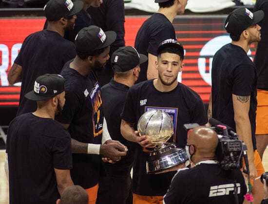 June 30, 2021, Los Angeles, California, USA: Devin Booker 1 of the Phoenix Suns holds the Western Conference Finals Trophy after winning Game 6 of the Western Conference Finals of the 2021 NBA, Basketball Herren, USA Playoffs against Los Angeles Clippers on Wednesday June 30, 2021 at Staples Center in Los Angeles, California. Clippers lose to Suns, 103-130. JAVIER ROJASPI Los Angeles USA - ZUMAp124 20210630_zaa_p124_031 Copyright: xx