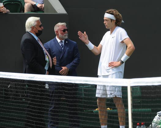 Tennis - 2021 All England Championships - Week One - Day Five (Friday) - Wimbledon Fabio Fognini v Andre Rublev Andre Rublev complains to the referee while Fognini gets treatment 