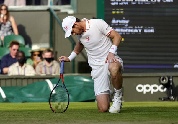 Mandatory Credit: Photo by Shutterstock (12193045hz) Andy Murray checking his tennis shoes during his third round match Wimbledon Tennis Championships, Day 5, The All England Lawn Tennis and Croquet Club, London, UK - 02 Jul 2021 Wimbledon Tennis Championships, Day 5, The All England Lawn Tennis and Croquet Club, London, UK - 02 Jul 2021  Copyright: xShutterstockx 12193045hz