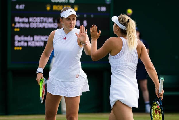 July 2, 2021: Marta Kostyuk of Ukraine & Jelena Ostapenko of Latvia playing doubles at the 2021 Wimbledon Championships Grand Slam tennis tournament - ZUMAa181 20210702_zaa_a181_070 Copyright: xRobxPrangex
