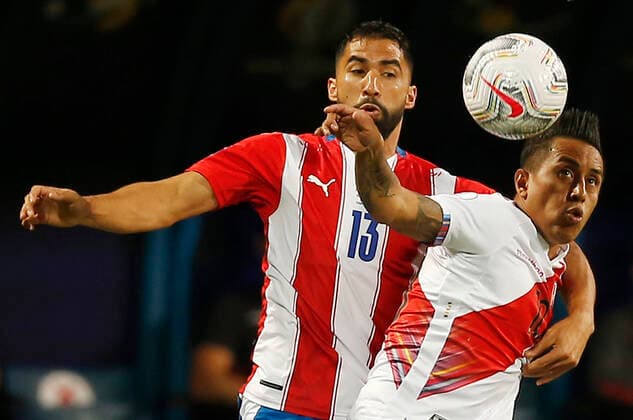 (210703) -- GOIANIA, July 3, 2021 -- Peru s Christian Cueva (R) vies with Paraguay s Alberto Espinola during the 2021 Copa America Quarterfinals football match between Peru and Paraguay in Goiania, Brazil, on July 2, 2021. ) (SP)BRAZIL-GOIANIA-COPA AMERICA-PERU VS PARAGUAY LUCIOxTAVORA 