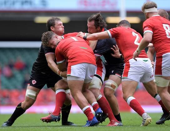 Mandatory Credit: Photo by Ryan Hiscott JMP Shutterstock (12194685e) Will Rowlands of Wales is tackled by Reegan O Gorman of Canada Wales v Canada, UK - 03 Jul 2021 Wales v Canada, UK - 03 Jul 2021  Copyright: xRyanxHiscott JMP Shutterstockx 12194685e