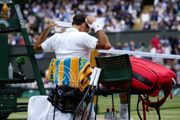 Mandatory Credit: Photo by Dave Shopland Shutterstock (12194409gd) Roger Federer changing his headband during his third round match Wimbledon Tennis Championships, Day 6, The All England Lawn Tennis and Croquet Club, London, UK - 03 Jul 2021 Wimbledon Tennis Championships, Day 6, The All England Lawn Tennis and Croquet Club, London, UK - 03 Jul 2021  Copyright: xDavexShopland Shutterstockx 12194409gd