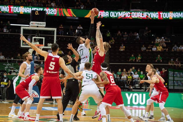 (210704) -- KAUNAS, July 4, 2021 -- Jonas Valanciunas (Top, L) of Lithuania competes with Aleksander Roman Balcerowski (Top, R) of Poland during FIBA Olympic Qualifyng Tournament basketball semi-final match between Lithuania and Poland in Kaunas, Lithuania, July 3, 2021. (Photo by Xinhua) (SP)LITHUANIA-KAUNAS-BASKETBALL- FIBA OQT-SEMI-FINALS-LITHUANIA VS POLAND AlfredasxPliadis 