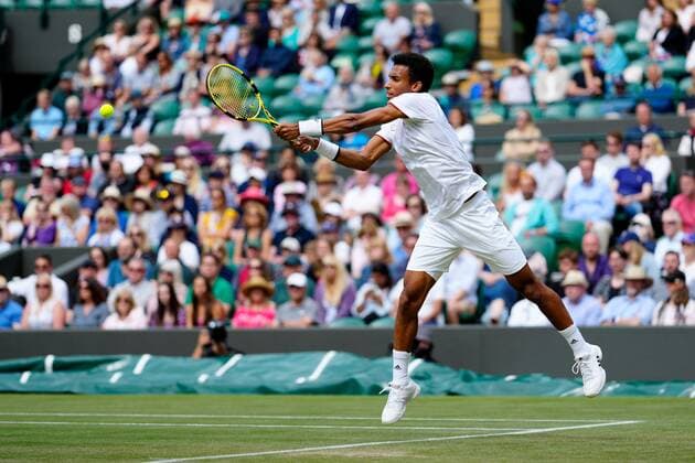 Mandatory Credit: Photo by Shutterstock (12196118dk) Felix Auger-Aliassime during his fourth round match Wimbledon Tennis Championships, Day 7, The All England Lawn Tennis and Croquet Club, London, UK - 05 Jul 2021 Wimbledon Tennis Championships, Day 7, The All England Lawn Tennis and Croquet Club, London, UK - 05 Jul 2021  Copyright: xShutterstockx 12196118dk
