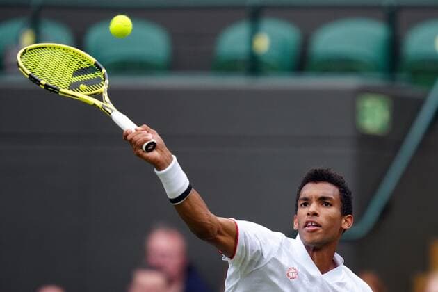 Mandatory Credit: Photo by Shutterstock (12196118eq) Felix Auger-Aliassime during his fourth round match Wimbledon Tennis Championships, Day 7, The All England Lawn Tennis and Croquet Club, London, UK - 05 Jul 2021 Wimbledon Tennis Championships, Day 7, The All England Lawn Tennis and Croquet Club, London, UK - 05 Jul 2021  Copyright: xShutterstockx 12196118eq