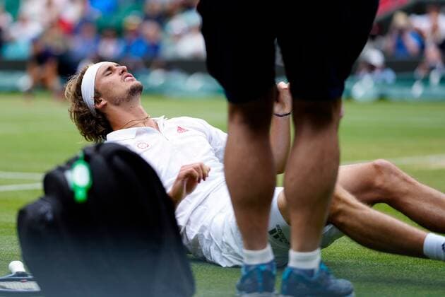 Mandatory Credit: Photo by Shutterstock (12196118et) Alexander Zverev oin the ground, injured, during his fourth round match Wimbledon Tennis Championships, Day 7, The All England Lawn Tennis and Croquet Club, London, UK - 05 Jul 2021 Wimbledon Tennis Championships, Day 7, The All England Lawn Tennis and Croquet Club, London, UK - 05 Jul 2021 Copyright: xShutterstockx 12196118et