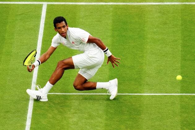 Mandatory Credit: Photo by Javier Garcia Shutterstock (12196117km) Felix Auger-Aliassime during his fourth round match Wimbledon Tennis Championships, Day 7, The All England Lawn Tennis and Croquet Club, London, UK - 05 Jul 2021 Wimbledon Tennis Championships, Day 7, The All England Lawn Tennis and Croquet Club, London, UK - 05 Jul 2021  Copyright: xJavierxGarcia Shutterstockx 12196117km
