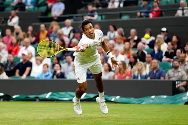 Mandatory Credit: Photo by Shutterstock (12196118gx) Felix Auger-Aliassime during his fourth round match Wimbledon Tennis Championships, Day 7, The All England Lawn Tennis and Croquet Club, London, UK - 05 Jul 2021 Wimbledon Tennis Championships, Day 7, The All England Lawn Tennis and Croquet Club, London, UK - 05 Jul 2021  Copyright: xShutterstockx 12196118gx