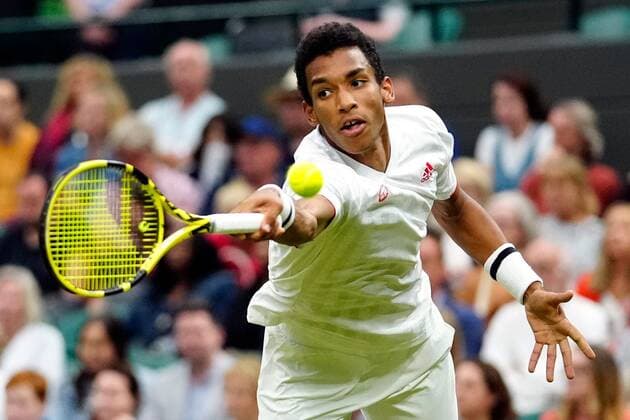 Mandatory Credit: Photo by Shutterstock (12196118gs) Felix Auger-Aliassime during his fourth round match Wimbledon Tennis Championships, Day 7, The All England Lawn Tennis and Croquet Club, London, UK - 05 Jul 2021 Wimbledon Tennis Championships, Day 7, The All England Lawn Tennis and Croquet Club, London, UK - 05 Jul 2021  Copyright: xShutterstockx 12196118gs