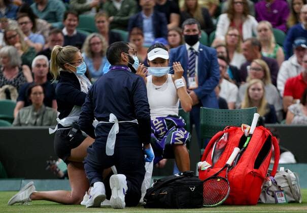 Mandatory Credit: Photo by Shutterstock (12196120ah) Emma Raducau of Great Britain receives a medical time out Wimbledon Tennis Championships, Day 7, The All England Lawn Tennis and Croquet Club, London, UK - 05 Jul 2021 Wimbledon Tennis Championships, Day 7, The All England Lawn Tennis and Croquet Club, London, UK - 05 Jul 2021  Copyright: xShutterstockx 12196120ah