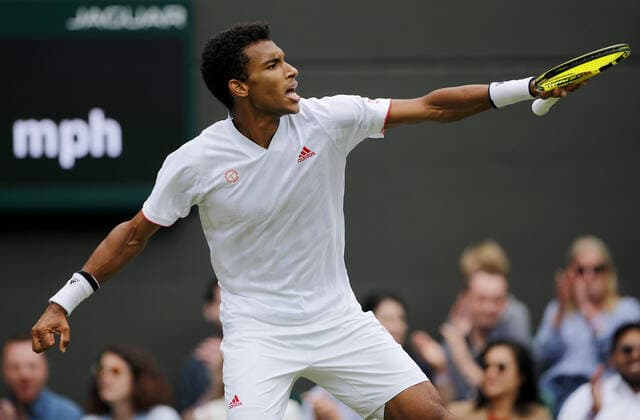 Mandatory Credit: Photo by Shutterstock (12196120be) Felix Auger Aliassime of Canada celebrates Wimbledon Tennis Championships, Day 7, The All England Lawn Tennis and Croquet Club, London, UK - 05 Jul 2021 Wimbledon Tennis Championships, Day 7, The All England Lawn Tennis and Croquet Club, London, UK - 05 Jul 2021  Copyright: xShutterstockx 12196120be