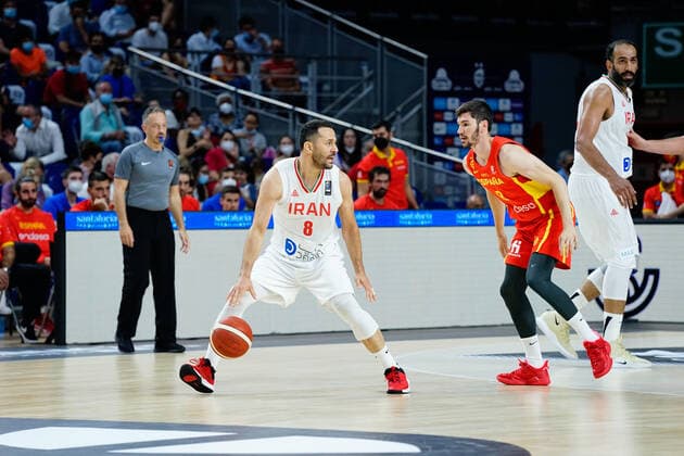 July 5, 2021, Madrid, Spain: Saeid Davarpanah (L) of Iran and Dario Brizuela (R) of Spain seen in action during Spain vs Iran friendly match of basketball at Wiznink Center in Madrid. Madrid Spain - ZUMAs197 20210705_zaa_s197_139 Copyright: xFrancisxGonzalezx