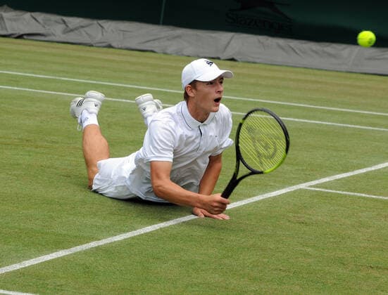 Lawn Tennis - 2021 All England Championships - Week Two - Wednesday - Wimbledon Boys event - Oliver Tarvet v Viacheslav Bielinskyi Oliver Tarvet of GBR slips on the grass 