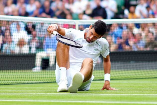 Mandatory Credit: Photo by Javier Garcia Shutterstock (12199110u) Novak Djokovic slipping over during his quarter-final match Wimbledon Tennis Championships, Day 9, The All England Lawn Tennis and Croquet Club, London, UK - 07 Jul 2021 Wimbledon Tennis Championships, Day 9, The All England Lawn Tennis and Croquet Club, London, UK - 07 Jul 2021  Copyright: xJavierxGarcia Shutterstockx 12199110u