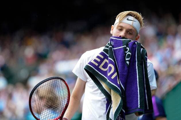 Mandatory Credit: Photo by Shutterstock (12199111er) Denis Shapovalov with a towel during his quarter-final match Wimbledon Tennis Championships, Day 9, The All England Lawn Tennis and Croquet Club, London, UK - 07 Jul 2021 Wimbledon Tennis Championships, Day 9, The All England Lawn Tennis and Croquet Club, London, UK - 07 Jul 2021  Copyright: xShutterstockx 12199111er