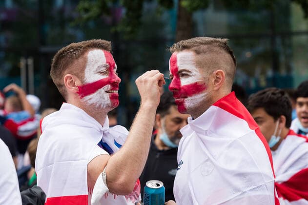 Football Fans Arrive At Wembley Stadium For England Vs Denmark Euro 2020 Semi-Final In London LONDON, UNITED KINGDOM - JULY 07, 2021: England football fans paint the faces as they arrive at Wembley Stadium ahead of England match against Denmark in the semi-final of Euro 2020 Championship on July 07, 2021 in London, England. The capacity for the semi-finals and Sunday s final at Wembley has been increased to 75 per cent of the stadium s capacity with 60,000 spectators in attendance. London Greater London United Kingdom szymanowicz-football210707_npDMX  Copyright: xWIktorxSzymanowiczx