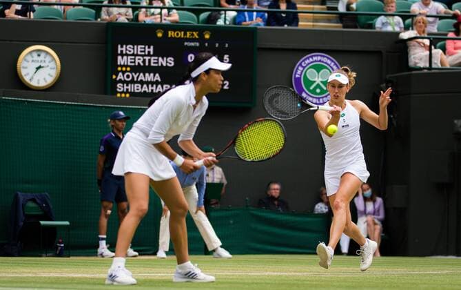 Mandatory Credit: Photo by Rob Prange Shutterstock (12202162t) Elise Mertens of Belgium & Su-Wei Hsieh of Chinese Taipeh in actin during the doubles semi-final of the 2021 Wimbledon Championships Grand Slam tennis tournament Wimbledon Tennis Championships, Day 11, The All England Lawn Tennis and Croquet Club, London, UK - 09 Jul 2021 Wimbledon Tennis Championships, Day 11, The All England Lawn Tennis and Croquet Club, London, UK - 09 Jul 2021  Copyright: xRobxPrange Shutterstockx 12202162t