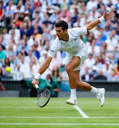 Mandatory Credit: Photo by Shutterstock (12202136dg) Novak Djokovic during his semi-final match Wimbledon Tennis Championships, Day 11, The All England Lawn Tennis and Croquet Club, London, UK - 09 Jul 2021 Wimbledon Tennis Championships, Day 11, The All England Lawn Tennis and Croquet Club, London, UK - 09 Jul 2021  Copyright: xShutterstockx 12202136dg