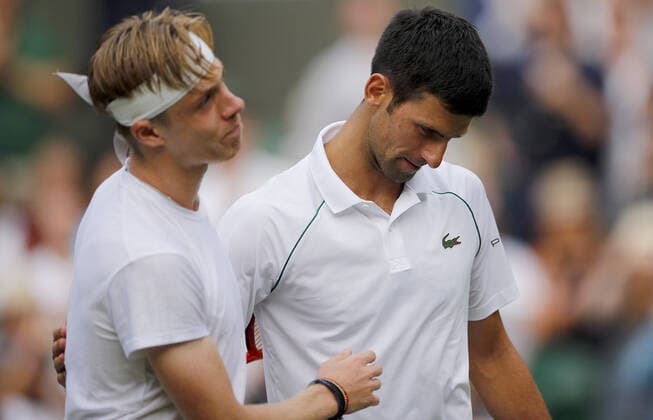 Mandatory Credit: Photo by Shutterstock (12202161bl) Novak Djokovic of Serbia with Denis Shapovalov of Canada at the net Wimbledon Tennis Championships, Day 11, The All England Lawn Tennis and Croquet Club, London, UK - 09 Jul 2021 Wimbledon Tennis Championships, Day 11, The All England Lawn Tennis and Croquet Club, London, UK - 09 Jul 2021  Copyright: xShutterstockx 12202161bl